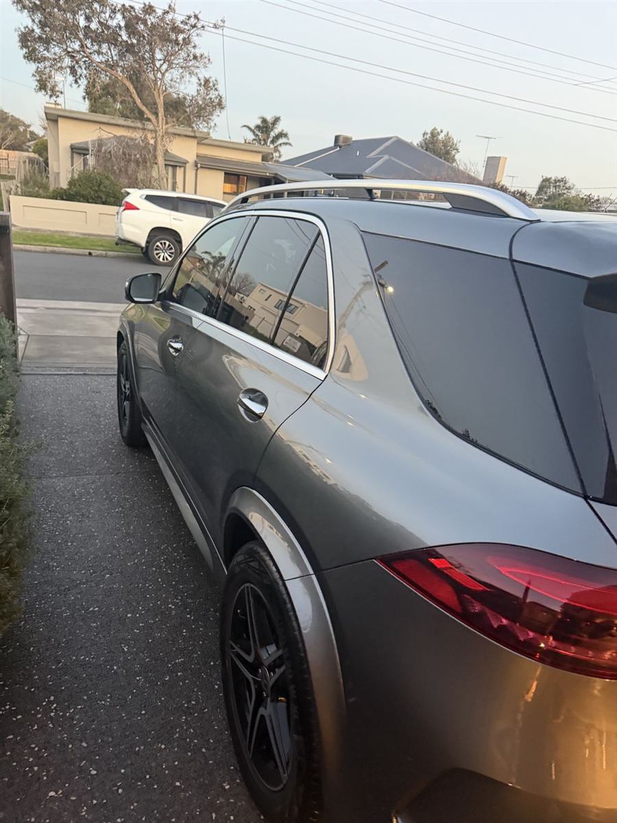 Freshly hand-washed Mercedes-Benz, rear side view